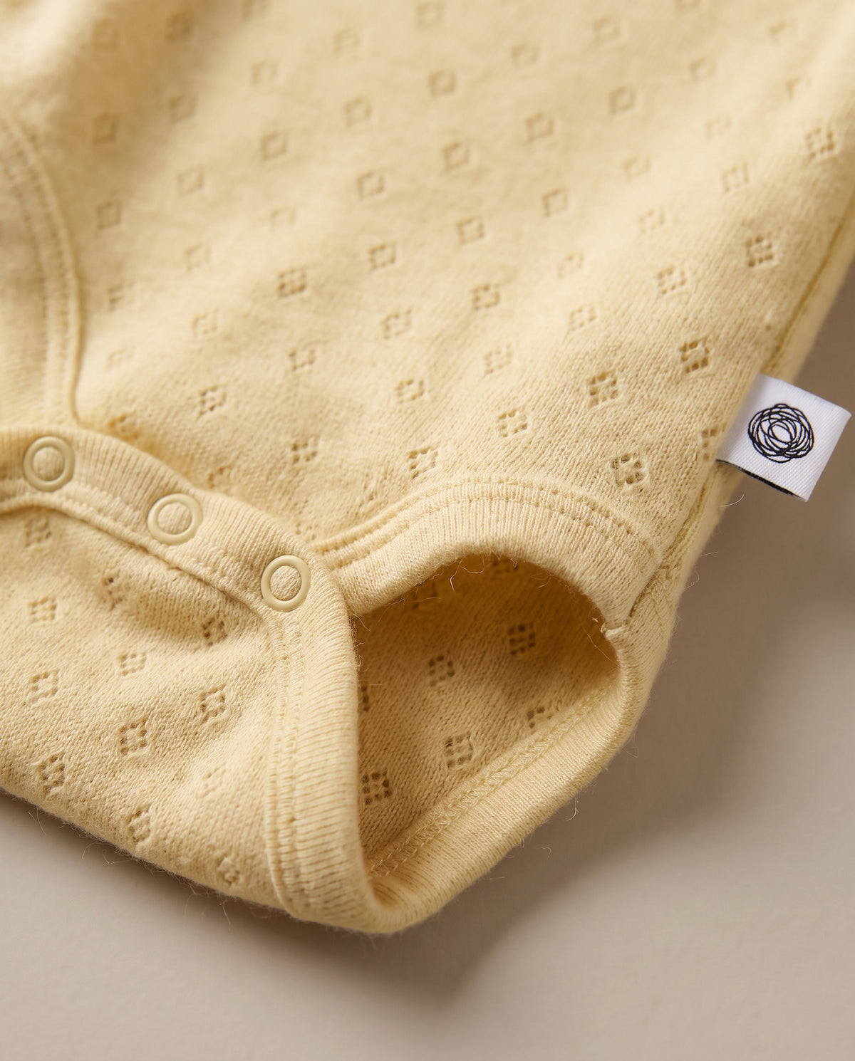 Wollen romper lange mouwen pointelle - merinowol - Dusty Yellow