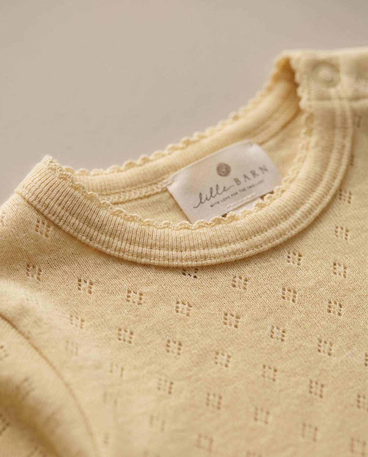 Wollen romper lange mouwen pointelle - merinowol - Dusty Yellow