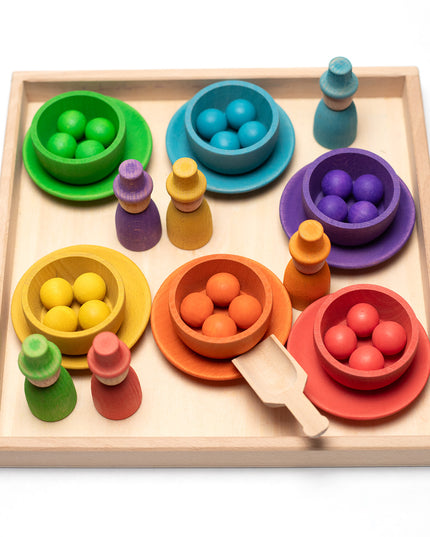 Wooden toys - Colored dolls, bowls and balls on a tray
