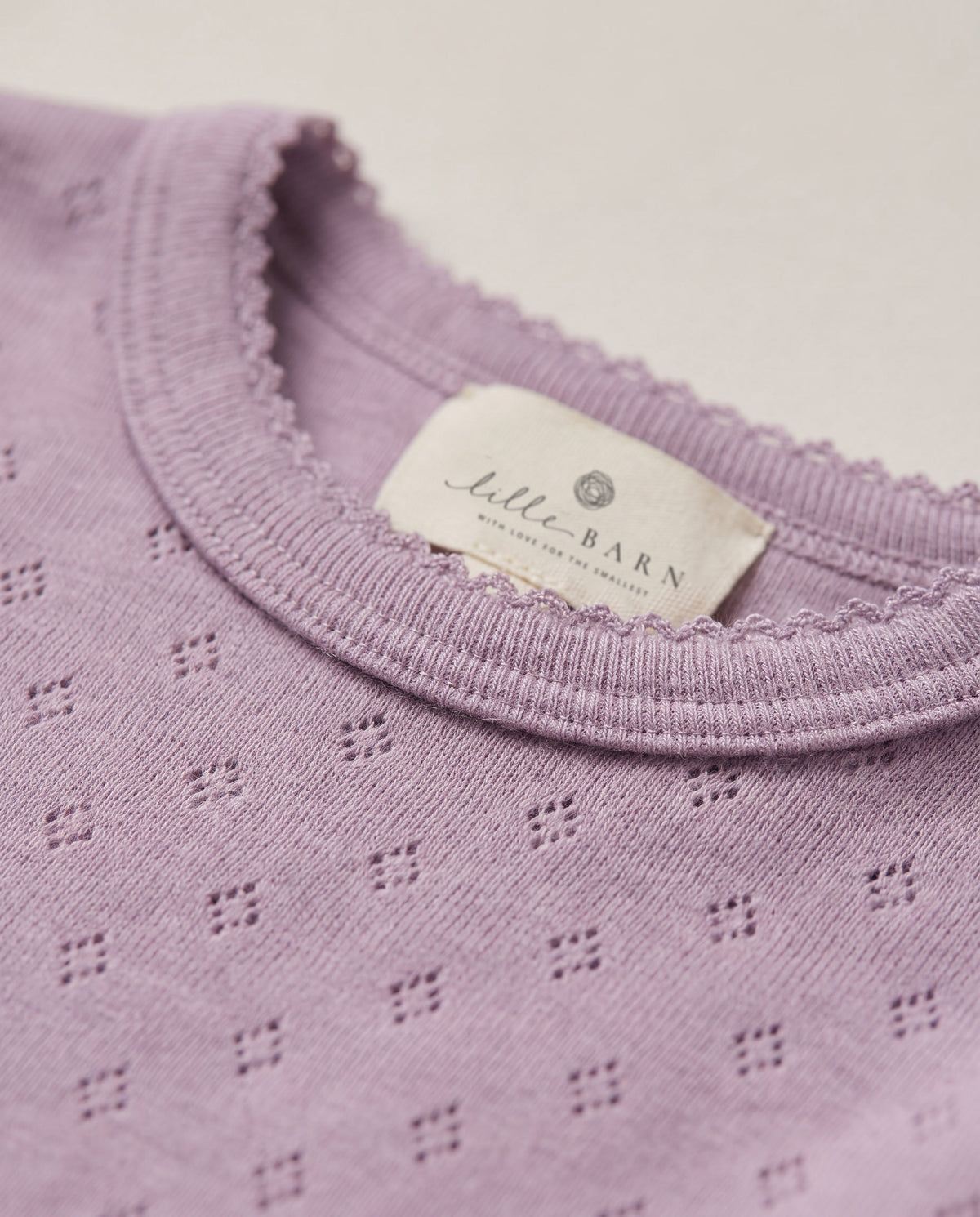 Uld buksedragt med korte ærmer pointelle – merinould – Lavender Frost